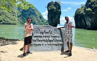 James Bond Island sign with limestone cliffs in Phang Nga Bay, Phuket.