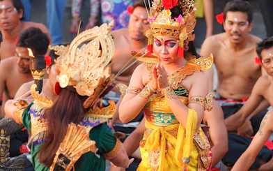 Balinese dancers in traditional attire performing a cultural dance in Bali, Indonesia.