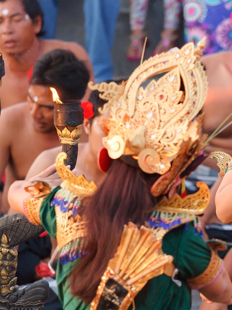 Balinese dancers in traditional attire performing a cultural dance in Bali, Indonesia.