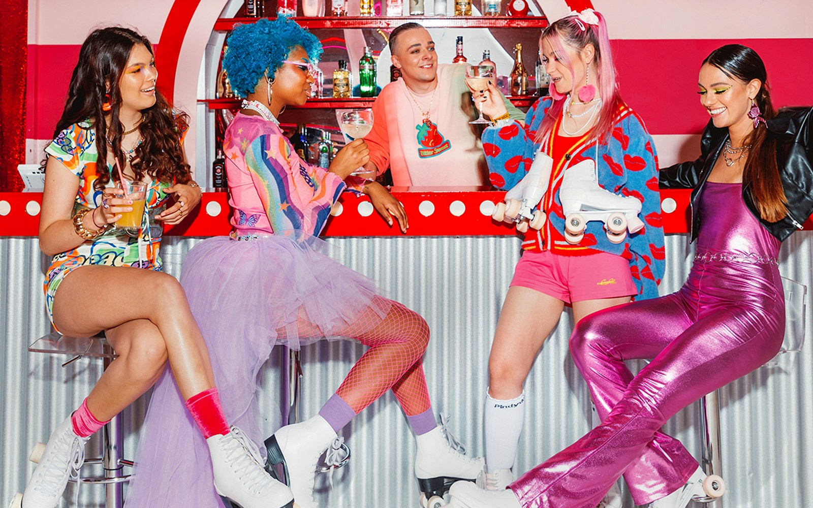 Roller skaters enjoying drinks at Amsterdam Roller Dreams Skating Rink bar.