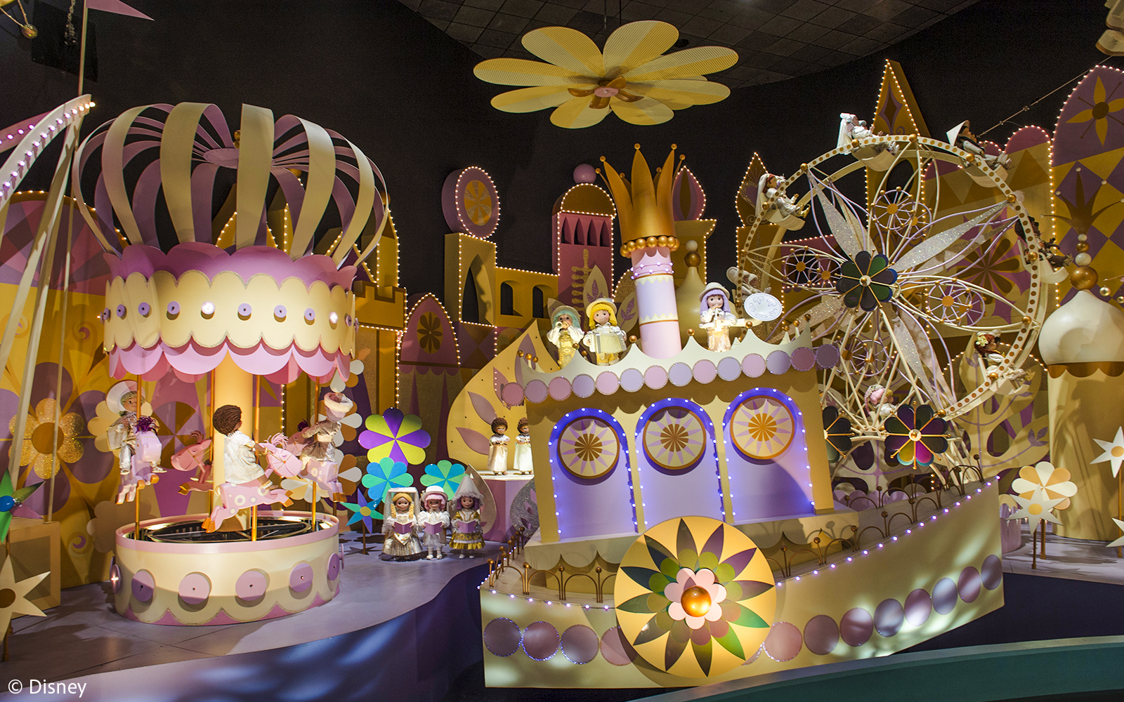 Colorful "It's a Small World" ride with animated dolls and vibrant decor at Hong Kong Disneyland.