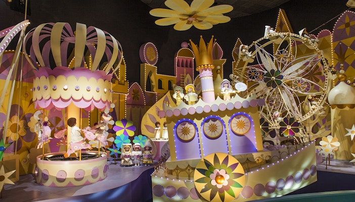 Colorful "It's a Small World" ride with animated dolls and vibrant decor at Hong Kong Disneyland.