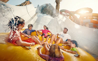 People enjoying Falcons Falaj water ride at YAS Waterworld, Abu Dhabi.