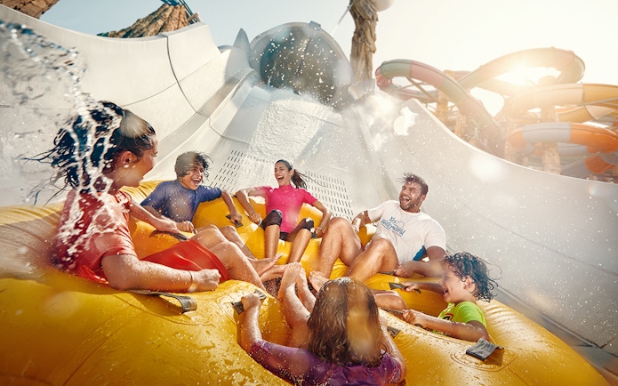 People enjoying Falcons Falaj water ride at YAS Waterworld, Abu Dhabi.