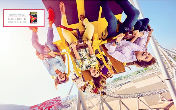 Roller coaster ride at Ferrari World Abu Dhabi with excited visitors.