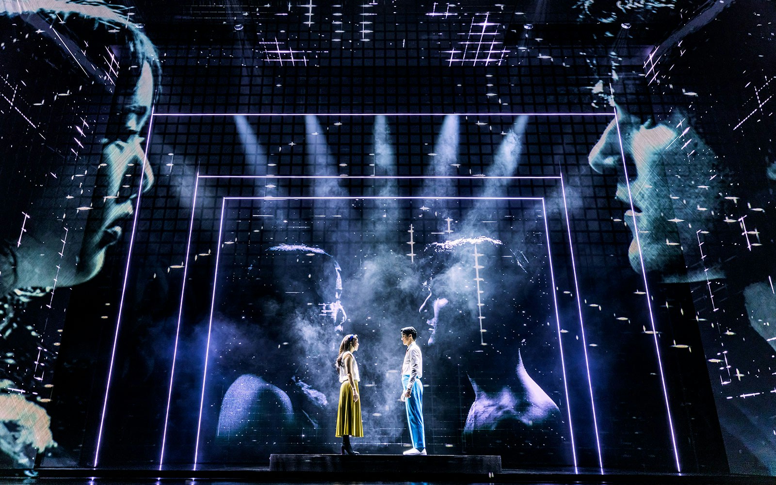 Stage performance of Maybe Happy Ending with two actors on a futuristic set.