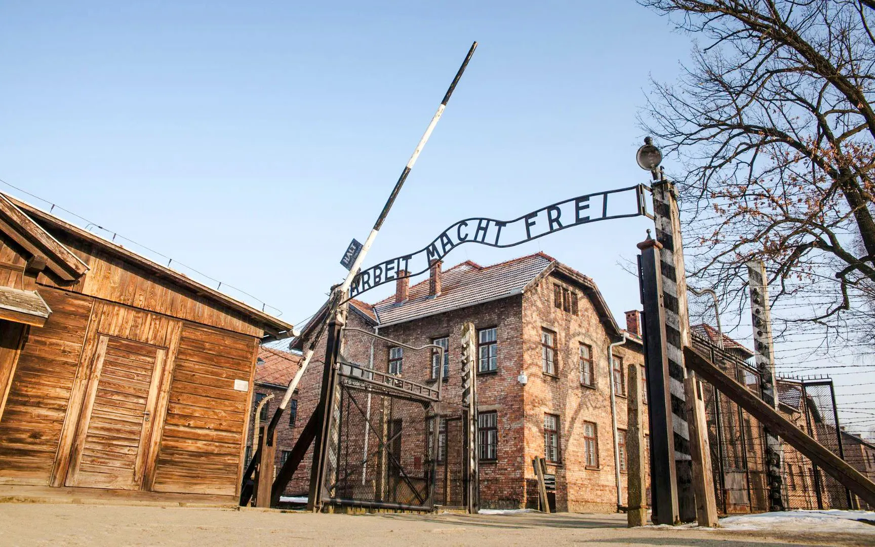Entrance gate with "Arbeit Macht Frei" sign at Auschwitz I concentration camp, Poland.