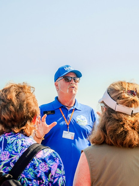 Tour guide leading a group at Niagara Falls, Canada.