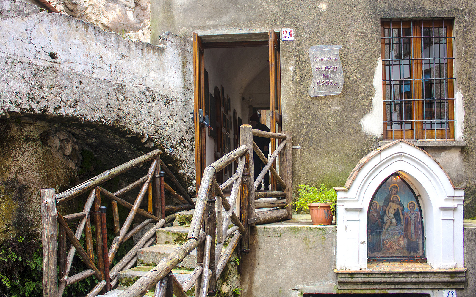 Museum of the Paper exhibit with ancient paper-making tools, part of Rome to Amalfi day trip experience.