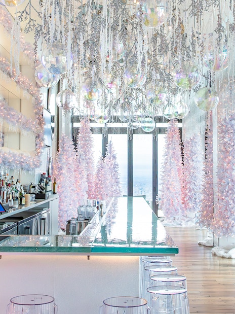 Winter-themed bar with white trees and lights at View Boston.