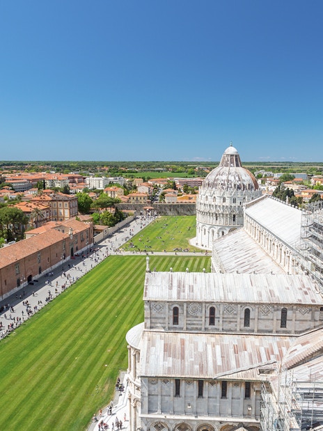 Panoramic view of Pisa Cathedral and surrounding cityscape from Leaning Tower.