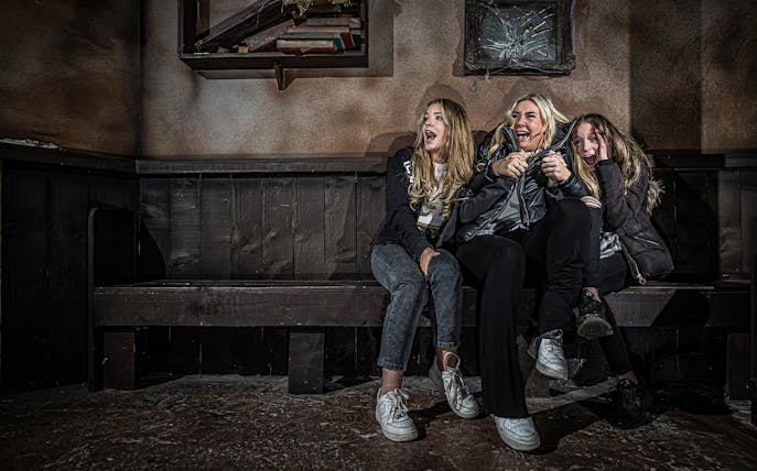 Guests reacting with excitement at the London Dungeon experience.