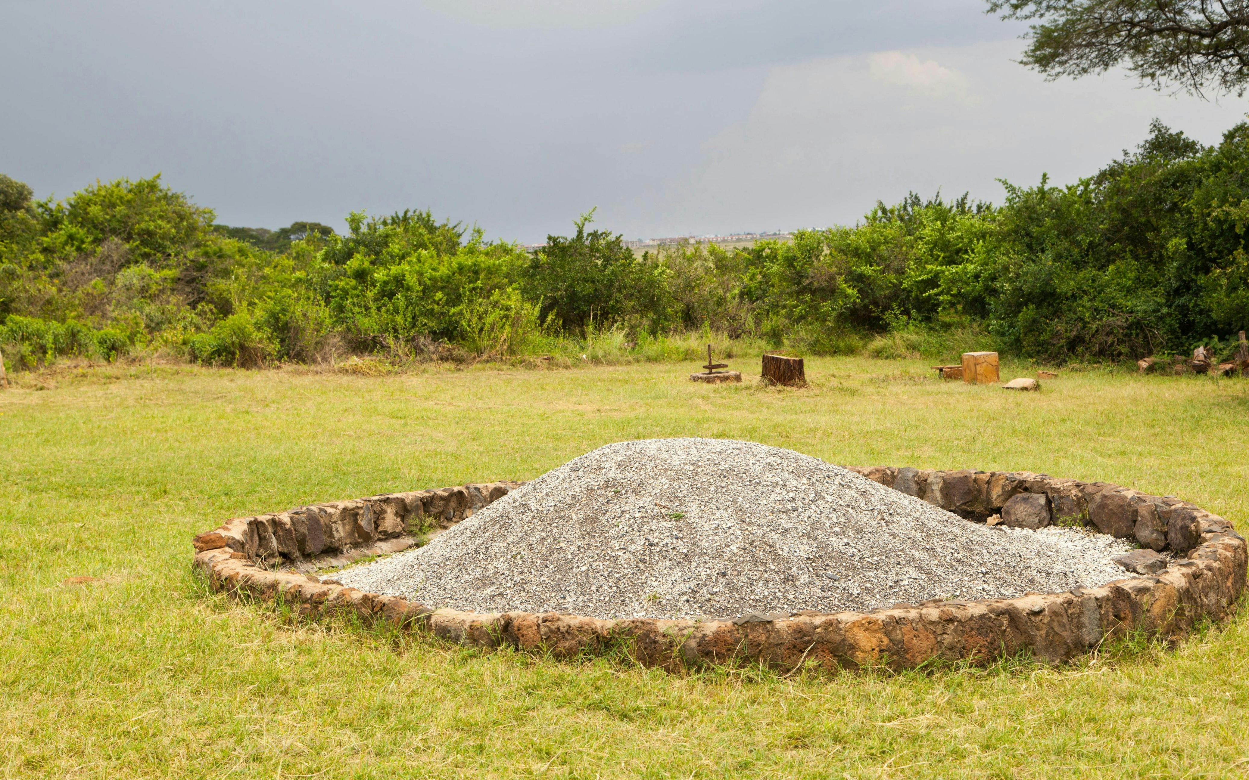 Ivory Burning Site at Nairobi National Park, Kenya, with ash mound and stone circle.