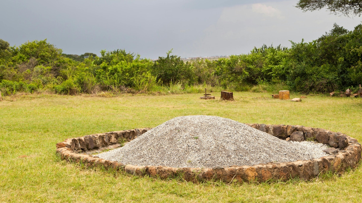 Ivory Burning Site at Nairobi National Park, Kenya, with ash mound and stone circle.