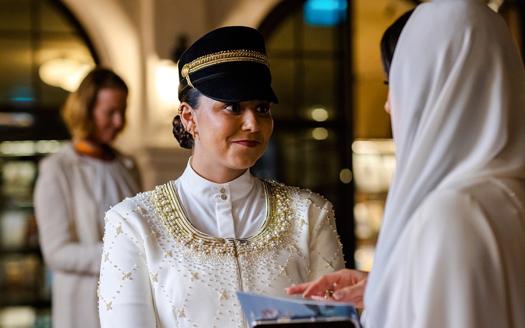 Guide in traditional attire during Abu Dhabi Royal Equestrian Arts tour.