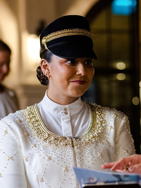 Guide in traditional attire during Abu Dhabi Royal Equestrian Arts tour.
