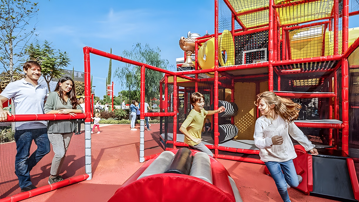 Family enjoying Kids’ Podium at Ferrari Land, PortAventura, Spain.