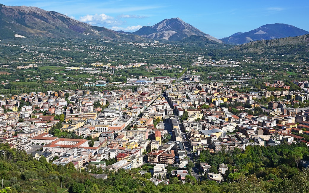 Aerial view of a town with mountains in the background on the Amalfi & Positano tour from Rome.