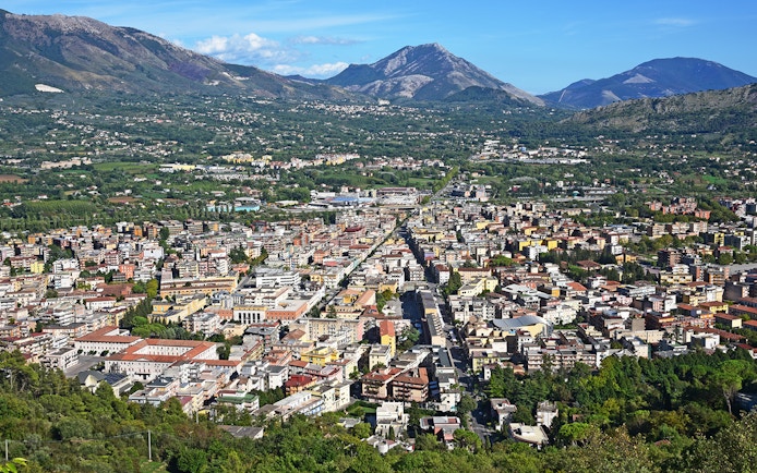 Aerial view of a town with mountains in the background on the Amalfi & Positano tour from Rome.