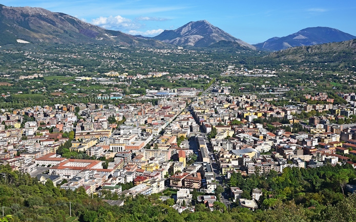 Aerial view of a town with mountains in the background on the Amalfi & Positano tour from Rome.