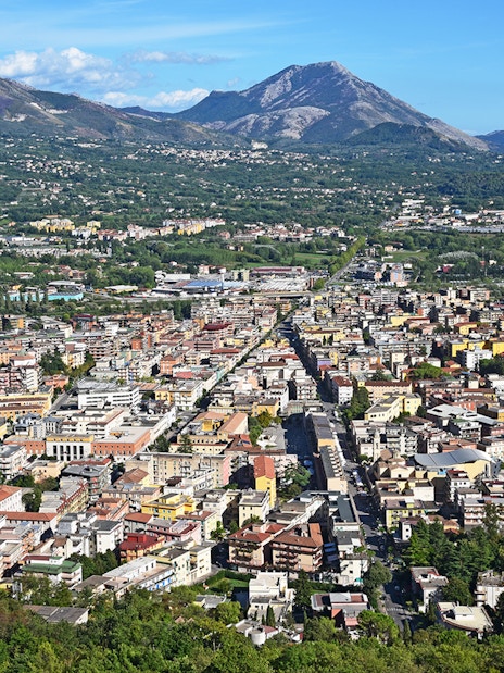 Aerial view of a town with mountains in the background on the Amalfi & Positano tour from Rome.