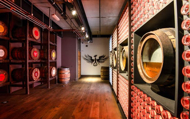Barrels and wall display inside Teeling Whiskey Distillery, Dublin.