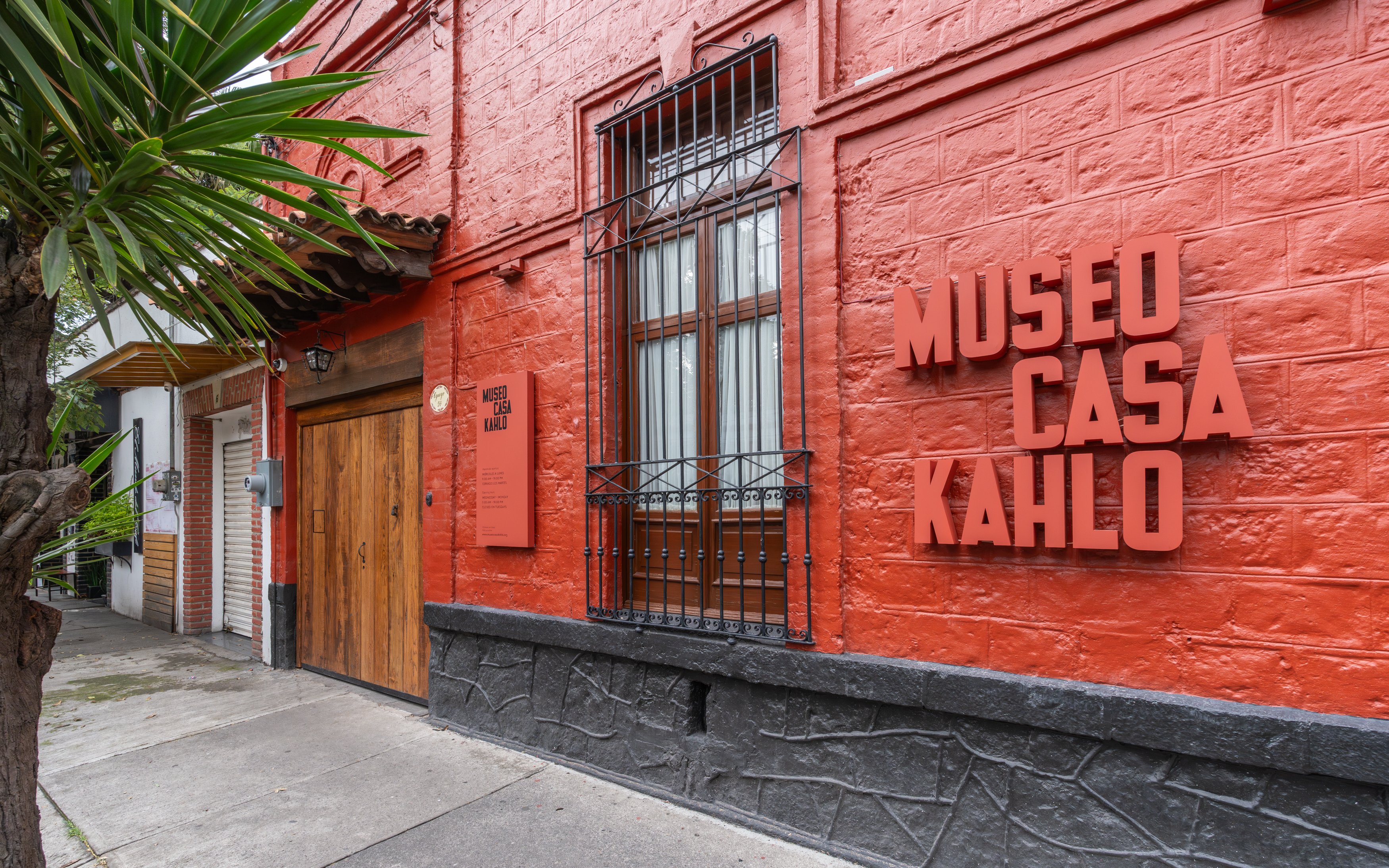 Museo Casa Kahlo entrance with red brick facade in Mexico City.