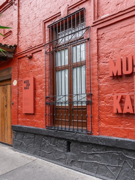 Museo Casa Kahlo entrance with red brick facade in Mexico City.
