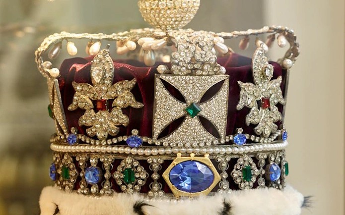 Crown adorned with diamonds and gemstones at Stichting Diamant Museum Amsterdam.