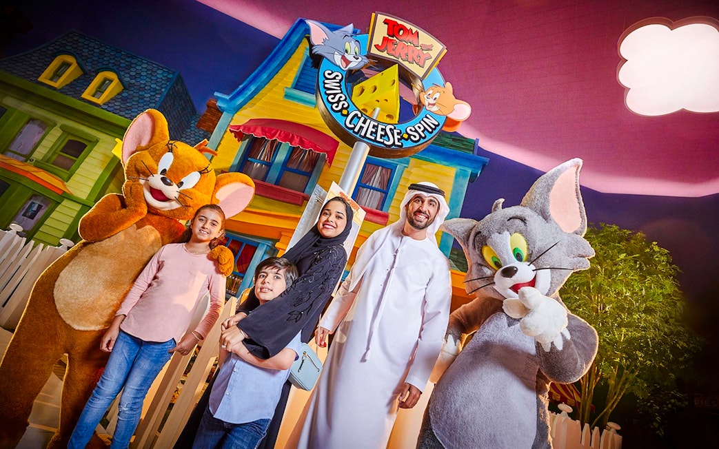 Family with Tom and Jerry characters at Warner Bros. World Abu Dhabi.