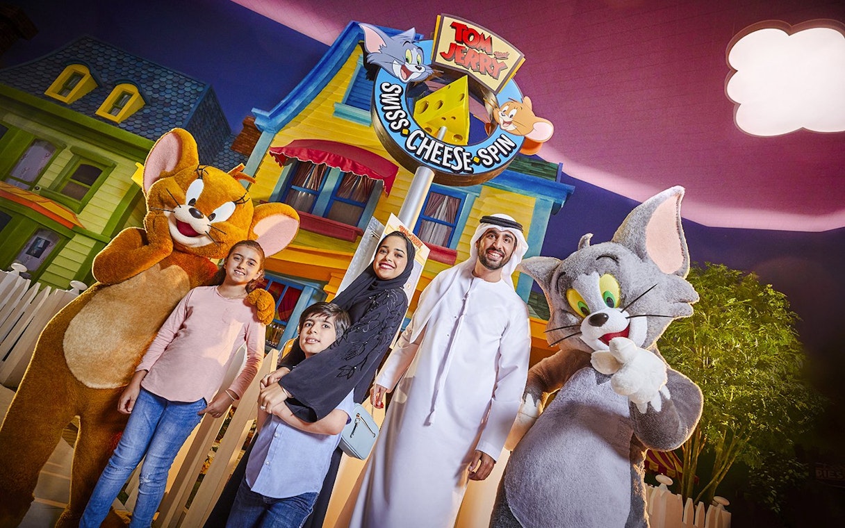 Family with Tom and Jerry characters at Warner Bros. World Abu Dhabi.