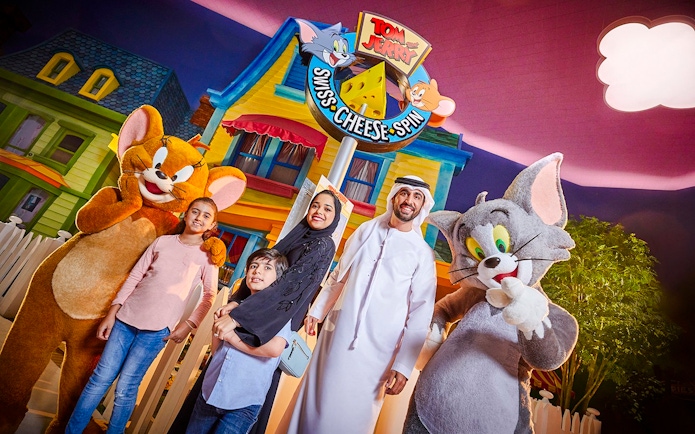 Family with Tom and Jerry characters at Warner Bros. World Abu Dhabi.