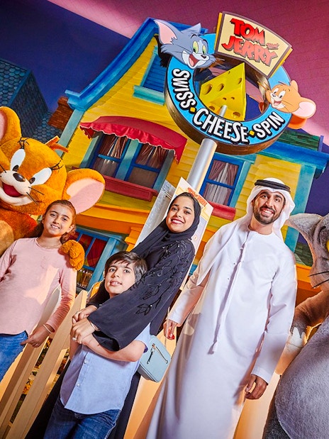 Family with Tom and Jerry characters at Warner Bros. World Abu Dhabi.