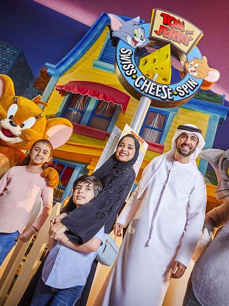 Family with Tom and Jerry characters at Warner Bros. World Abu Dhabi.