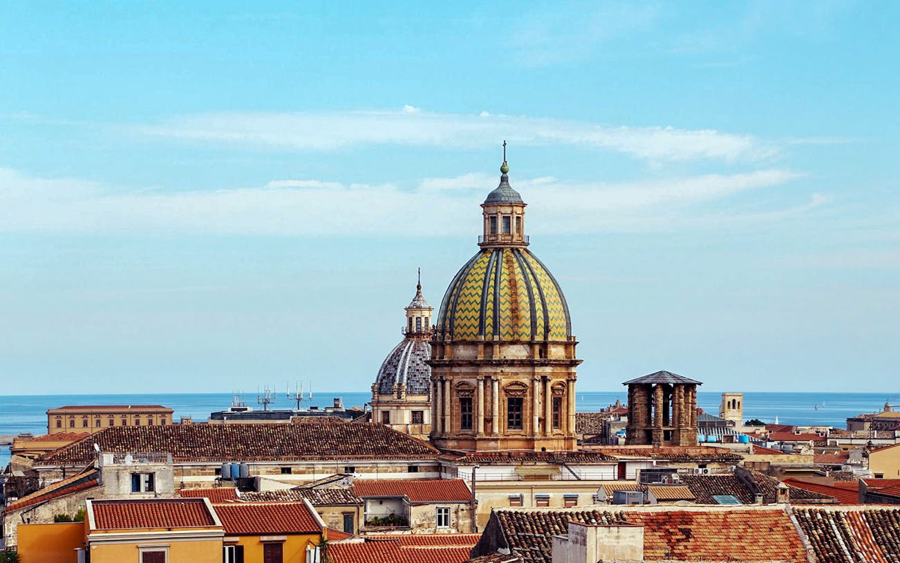 Palermo skyline with domed rooftops and sea view from panoramic terrace.