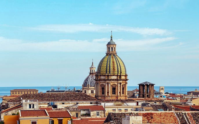 Palermo skyline with domed rooftops and sea view from panoramic terrace.