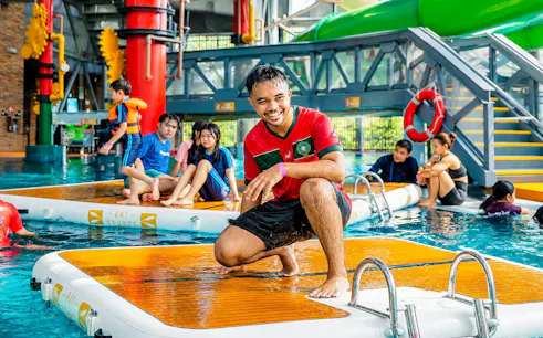 Tourists enjoying water activities at Singapore's Aqua Adventure park.