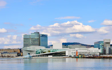 Oslo Opera House and cityscape viewed from Oslofjord cruise.