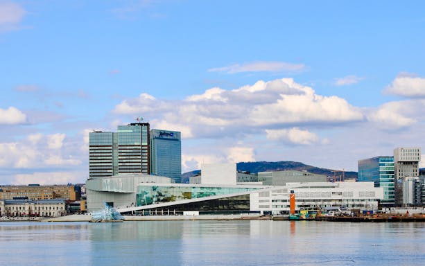 Oslo Opera House and cityscape viewed from Oslofjord cruise.