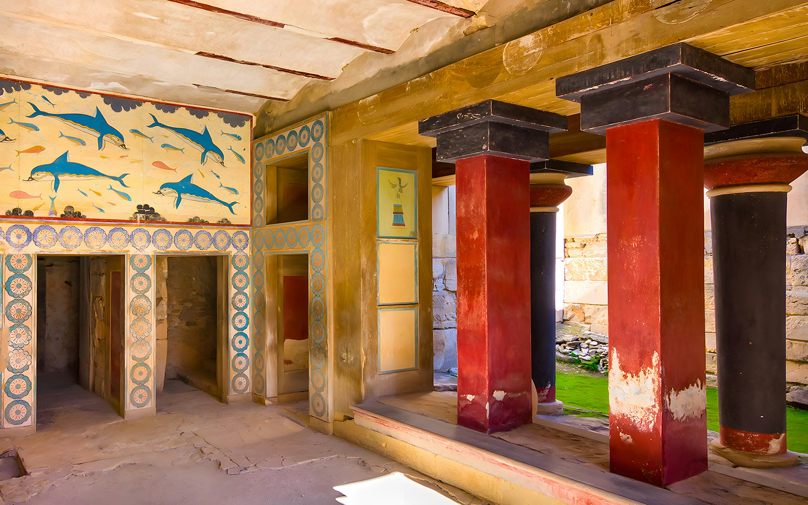 Knossos Palace interior with frescoes and red columns, Crete.