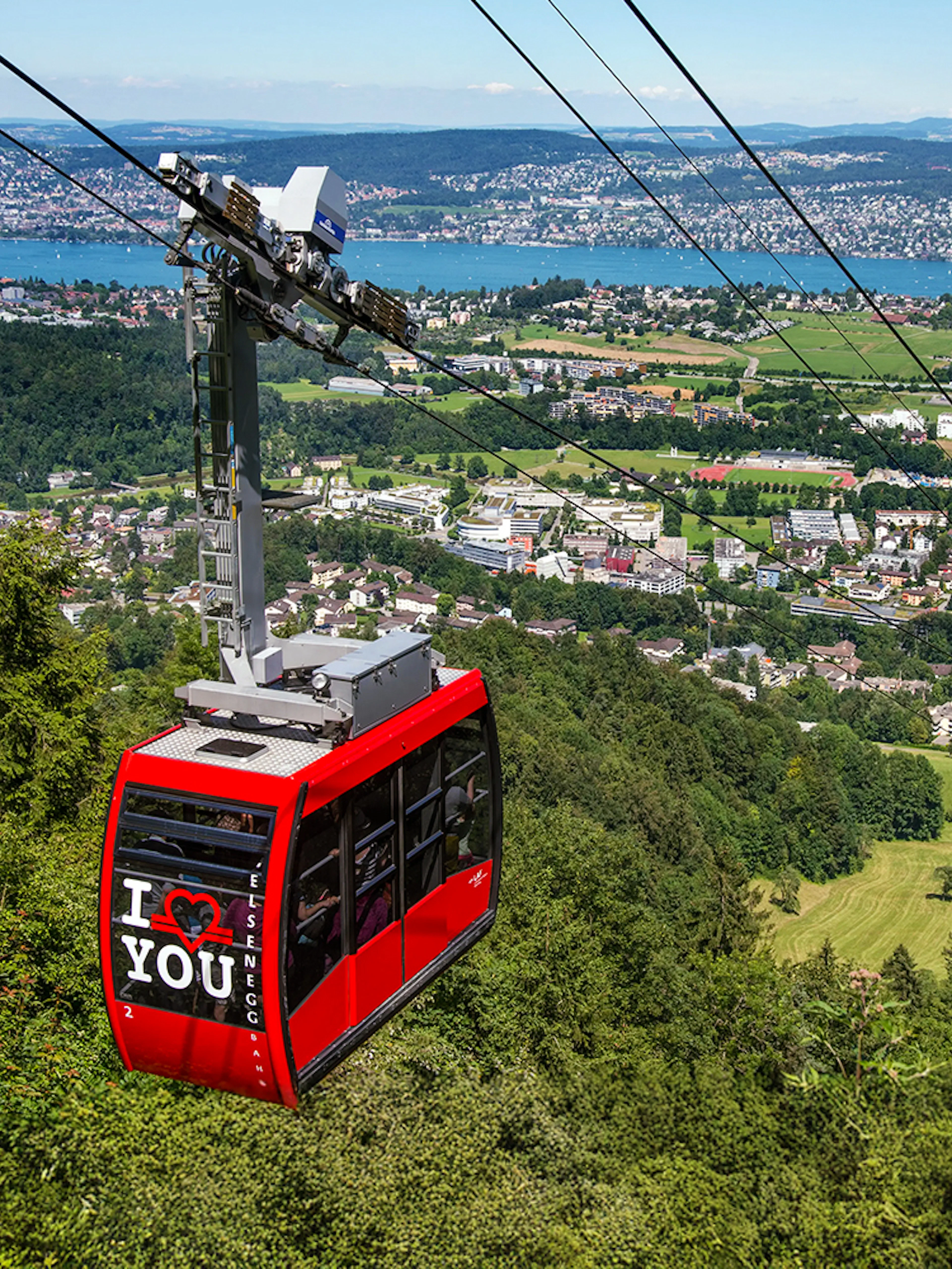 Felsenegg cable car over Zurich with city and lake views.