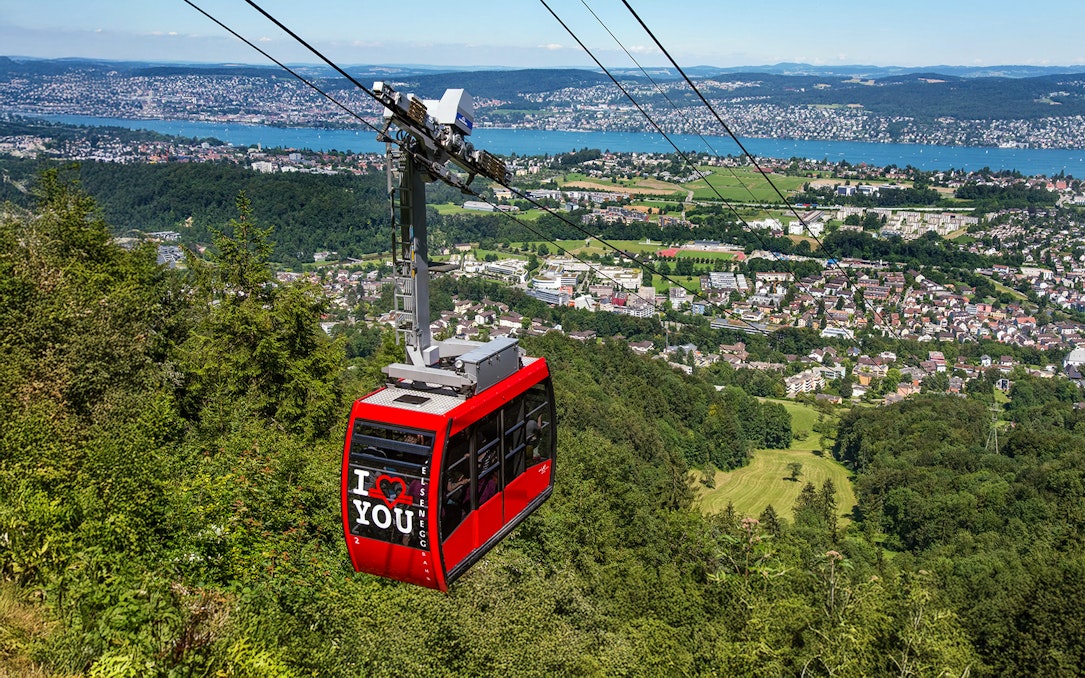 Felsenegg cable car over Zurich with city and lake views.