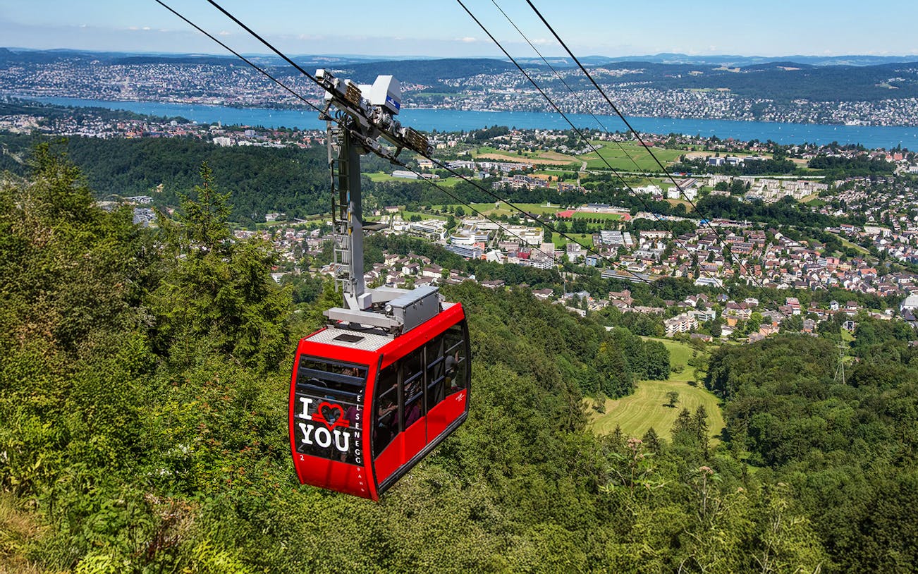 Felsenegg cable car over Zurich with city and lake views.