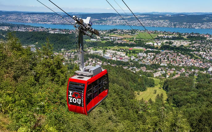 Felsenegg cable car over Zurich with city and lake views.