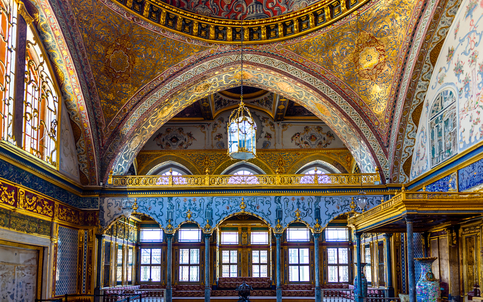 Interior of Topkapi Palace with ornate arches and detailed gold decorations, Istanbul.