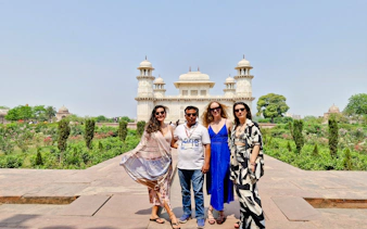 Tourists in front of Itimad-ud-Daulah's Tomb, Agra, during a guided day tour from Delhi.
