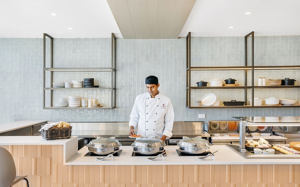 Chef preparing food at Plaza Premium Lounge, International Departures.