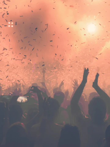 Crowd enjoying a vibrant party with confetti at 528 Ibiza.