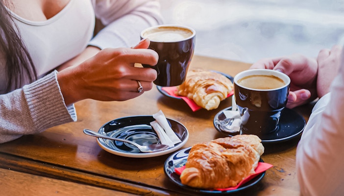 Couple having Coffee and Croissants