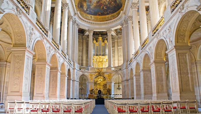 Royal Chapel interior with ornate ceiling and grand organ, Palace of Versailles, France.